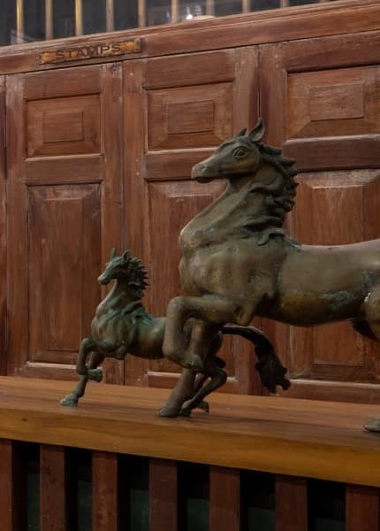 Bronze horse statuettes on the reception counter