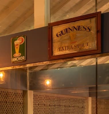 Vintage tin advertising signs mounted on the wall