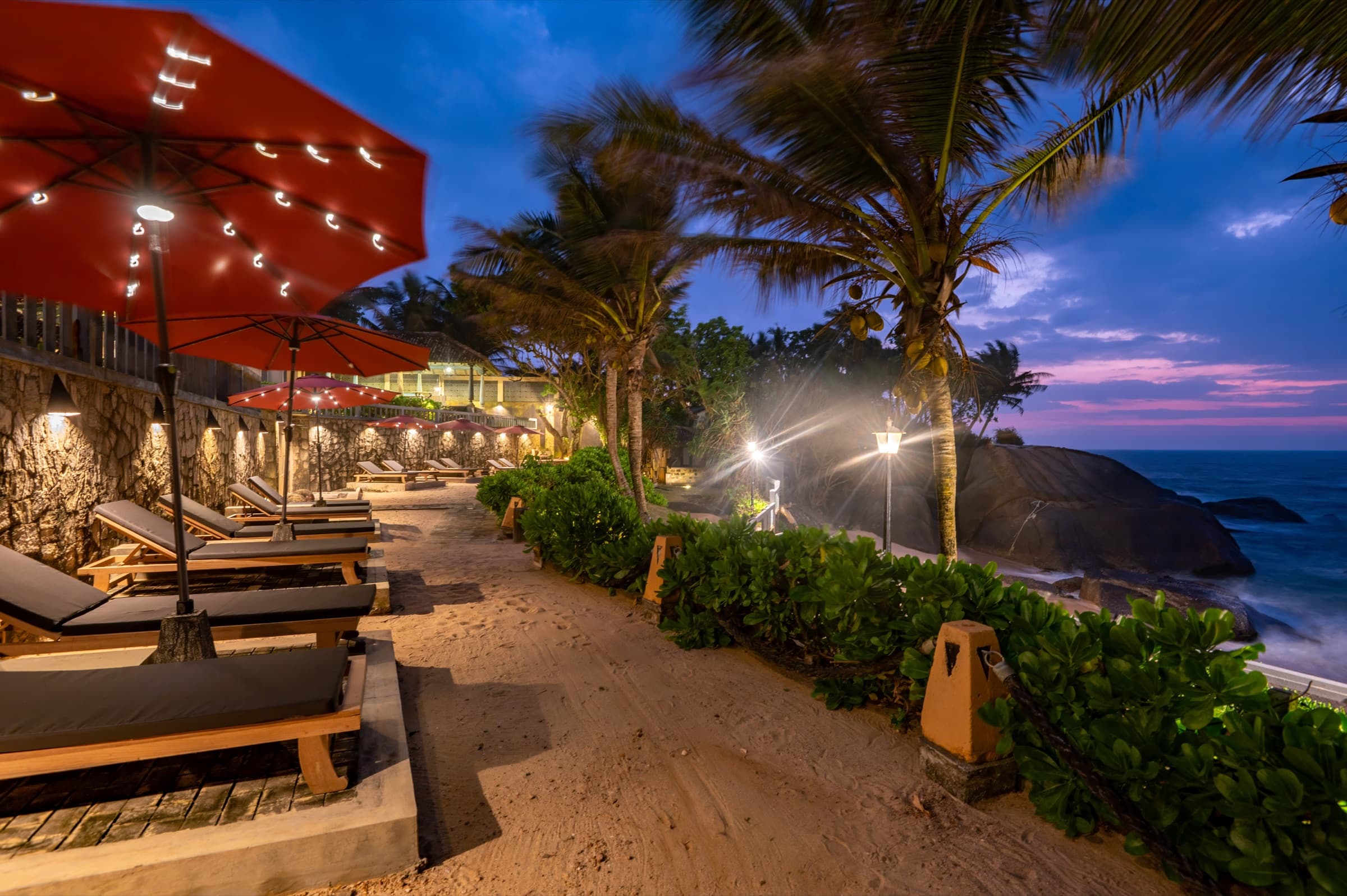Beachfront loungers at dusk