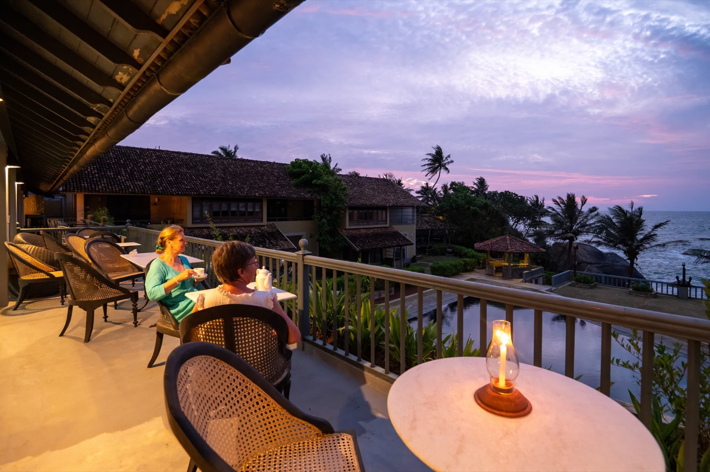 Guests dining on the terrace at night