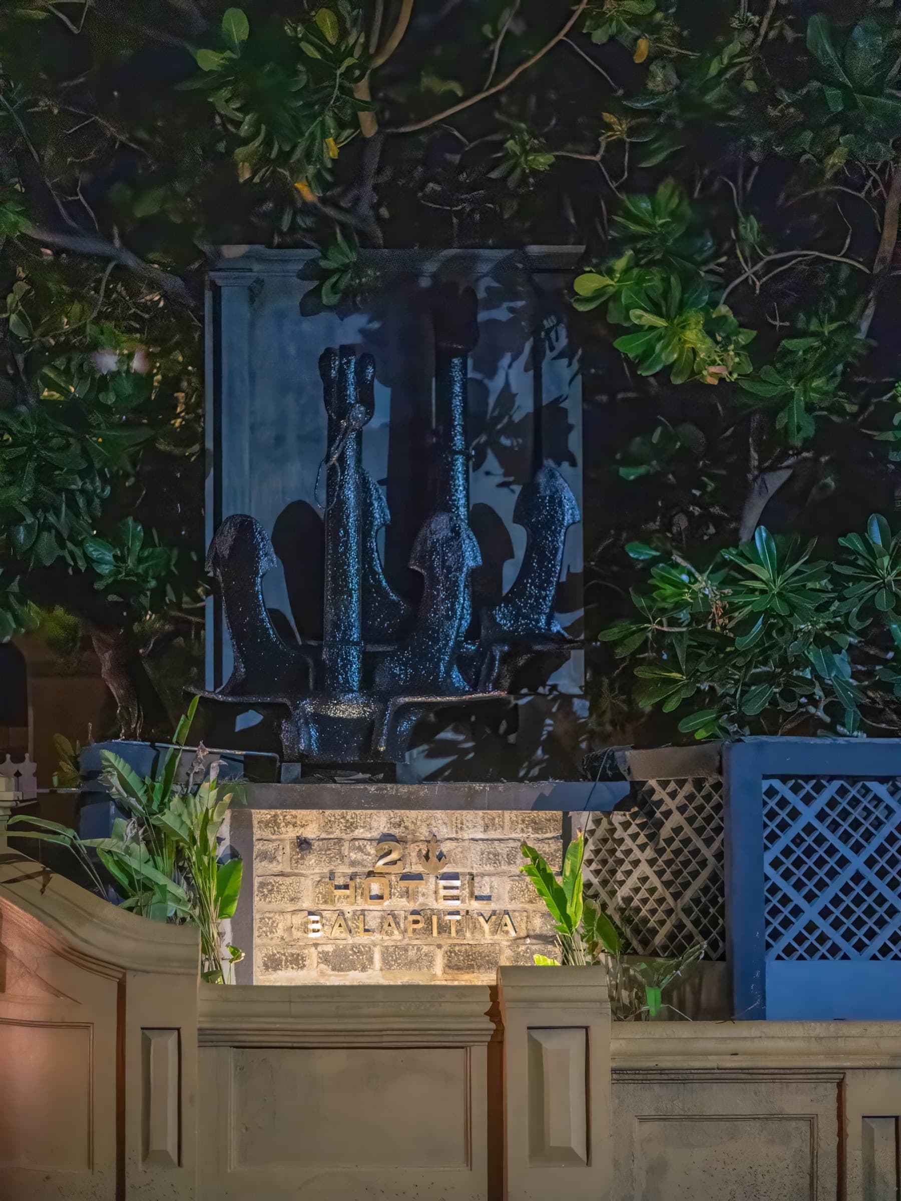 Heritage stone relief in the garden at night