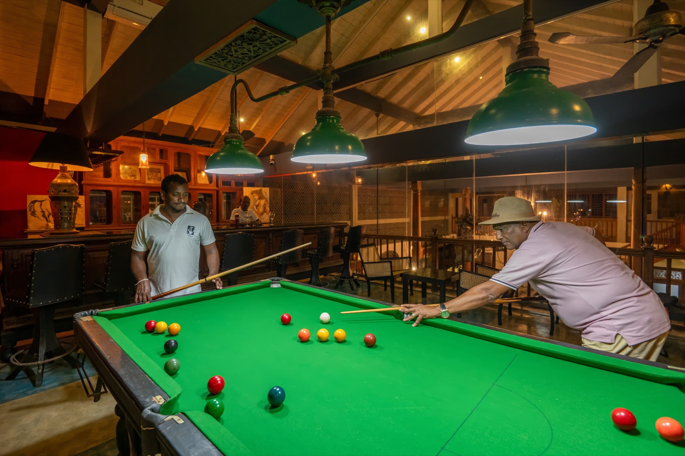 Guests playing billiards in the bar