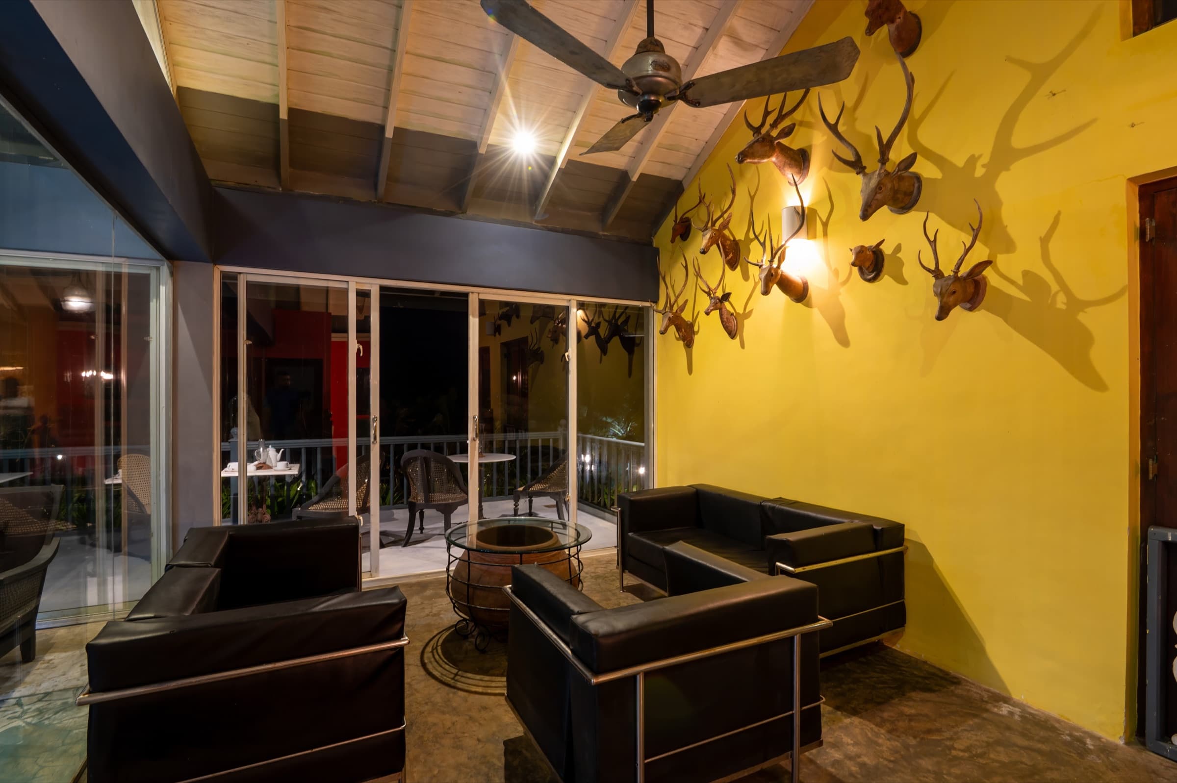 Lounge with yellow wall and decor