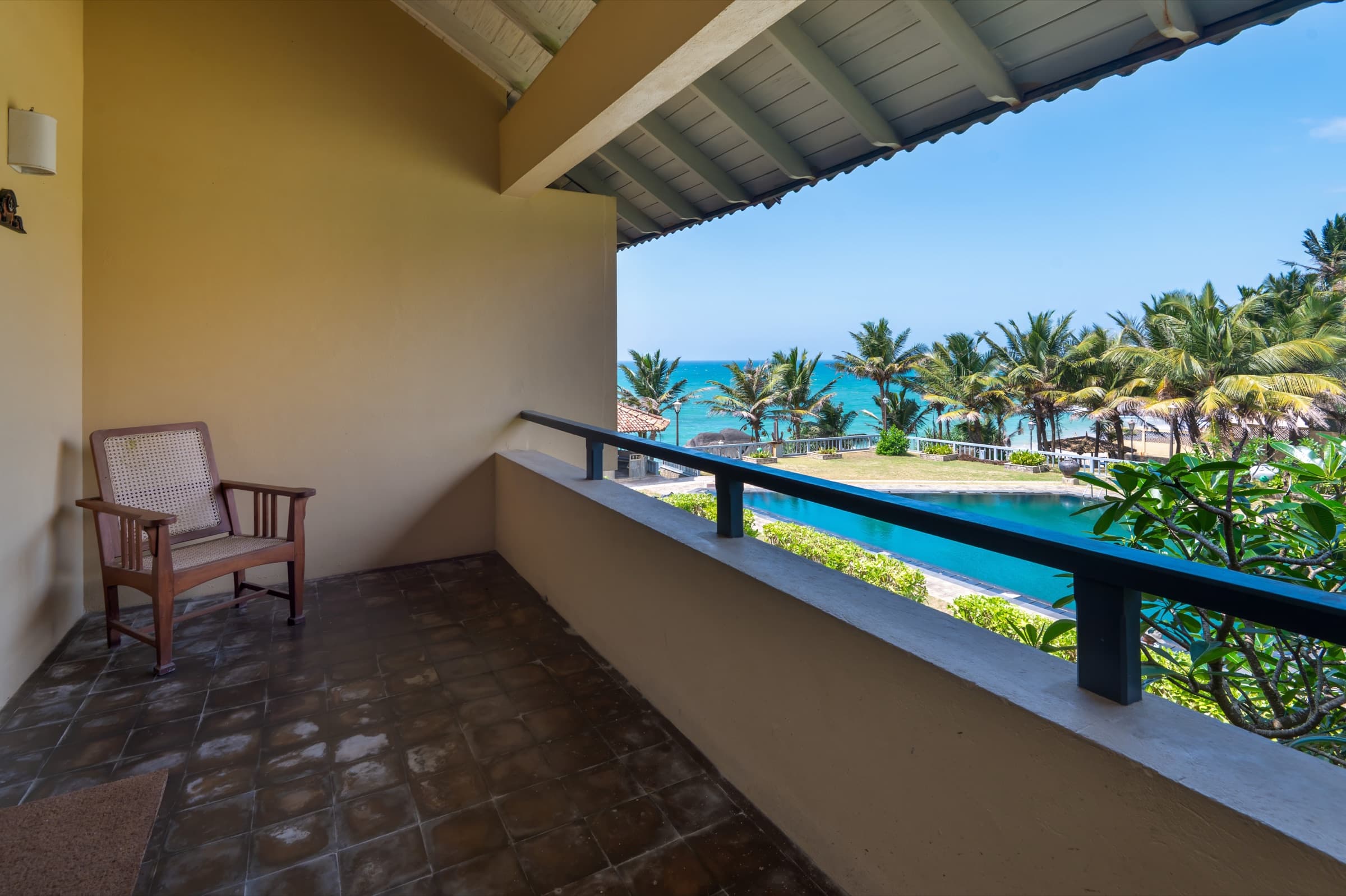 Room balcony with ocean and pool view