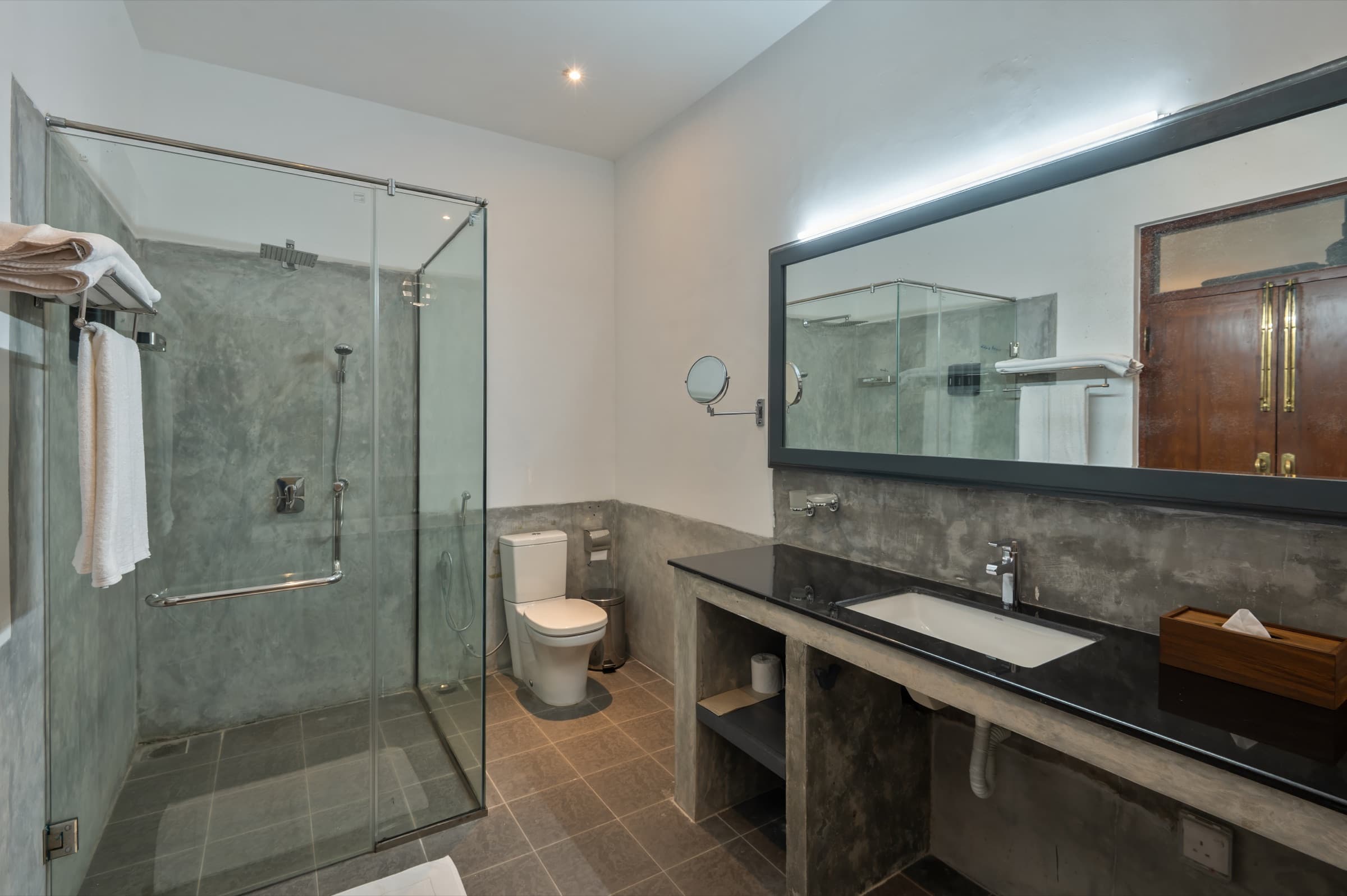 Bathroom with twin vanity and tub