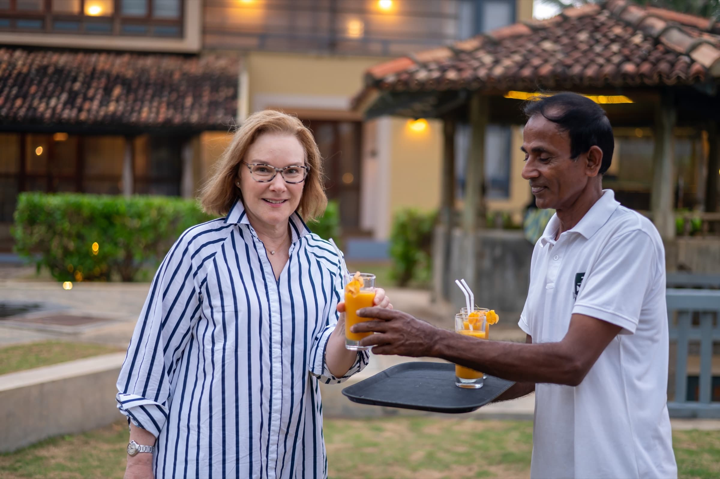 Staff serving drinks in the courtyard