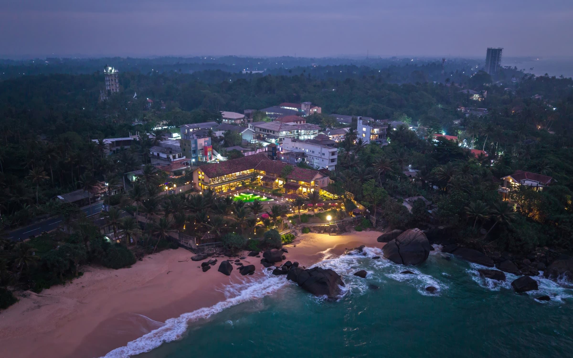 Aerial view of Two Anchor and the coastline at dusk